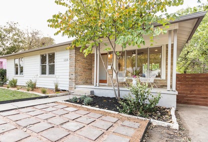 White bungalow with tree in front yard, Cherrywood, East Austin